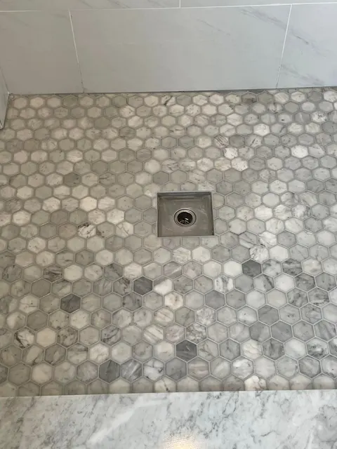 Carrara marble hexagon mosaic shower floor with square stainless steel drain